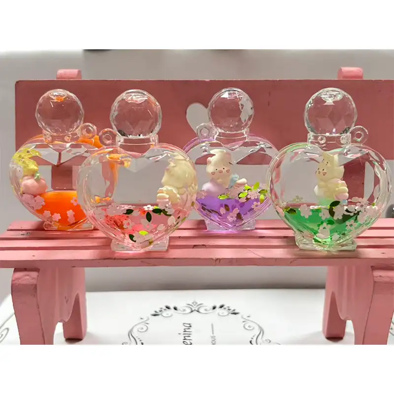 Porte-clés liquide en forme de cœur pour bouteille de parfum