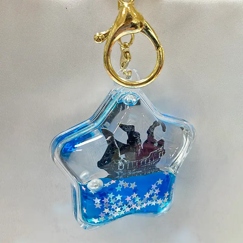 Nouveau type de porte-clés liquide étoile à cinq branches avec bordure